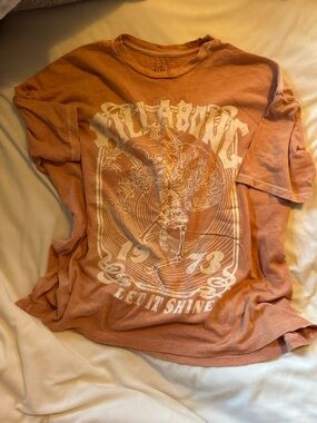 Billabong Womens Long Sleeve Tee in Faded Orange with White Graphic